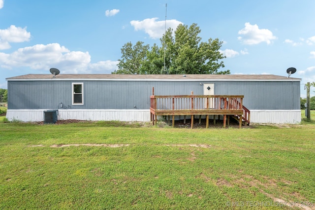 10180 S 241st W Ave, Sapulpa, OK 74066 - rear view of property featuring a wooden deck, a lawn, and central AC unit