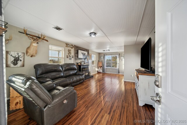 10180 S 241st W Ave, Sapulpa, OK 74066 - living area with plenty of natural light, wood finished floors, and baseboards