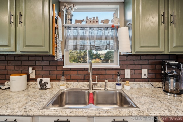 10180 S 241st W Ave, Sapulpa, OK 74066 - kitchen with green cabinetry, a sink, light countertops, and tasteful backsplash