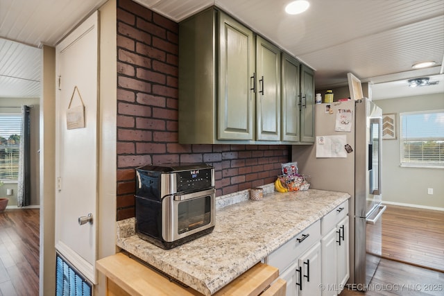 10180 S 241st W Ave, Sapulpa, OK 74066 - kitchen with wood finished floors, plenty of natural light, and freestanding refrigerator