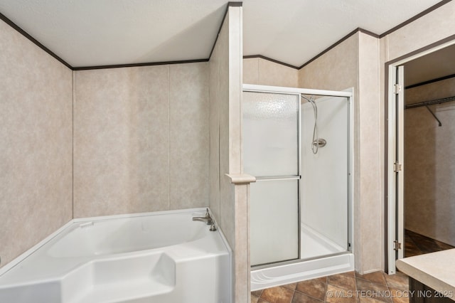 10180 S 241st W Ave, Sapulpa, OK 74066 - full bathroom featuring a stall shower, a garden tub, vaulted ceiling, crown molding, and a walk in closet