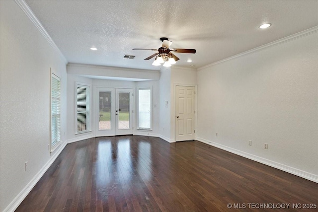 2259 E Rodeo Rd, Durant, OK 74701 - unfurnished room with a ceiling fan, baseboards, ornamental molding, dark wood-style flooring, and a textured ceiling