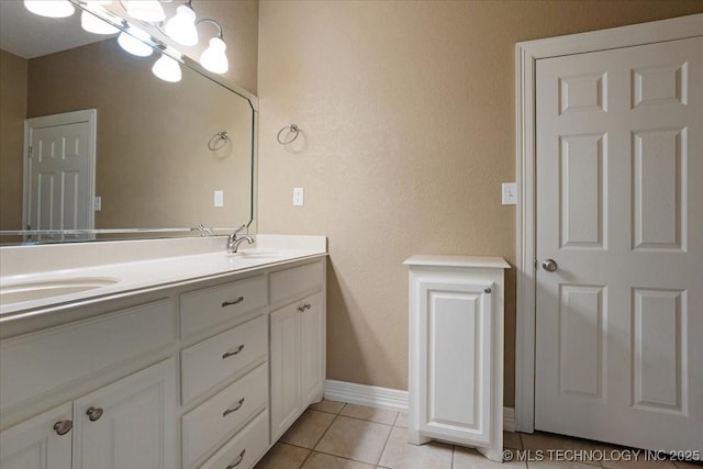 2259 E Rodeo Rd, Durant, OK 74701 - full bath featuring double vanity, tile patterned floors, and a chandelier