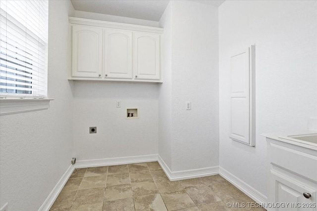 2259 E Rodeo Rd, Durant, OK 74701 - laundry area featuring hookup for a washing machine, hookup for an electric dryer, cabinet space, and baseboards