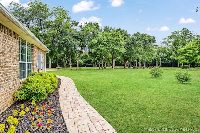2259 E Rodeo Rd, Durant, OK 74701 - view of grassy yard featuring view of wooded area