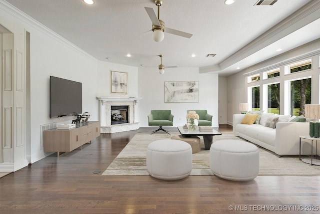 2259 E Rodeo Rd, Durant, OK 74701 - living room featuring recessed lighting, ceiling fan, wood finished floors, a fireplace, and ornamental molding