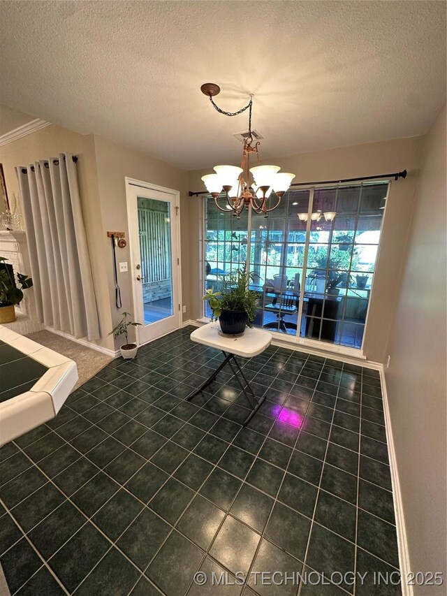 7604 N 127th E Ave, Owasso, OK 74055 - unfurnished dining area featuring a textured ceiling, a chandelier, baseboards, and tile patterned flooring