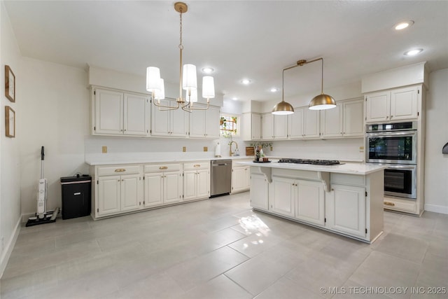 8721 S 65th E Pl, Tulsa, OK 74133 - kitchen with stainless steel appliances, light countertops, a chandelier, recessed lighting, and a center island
