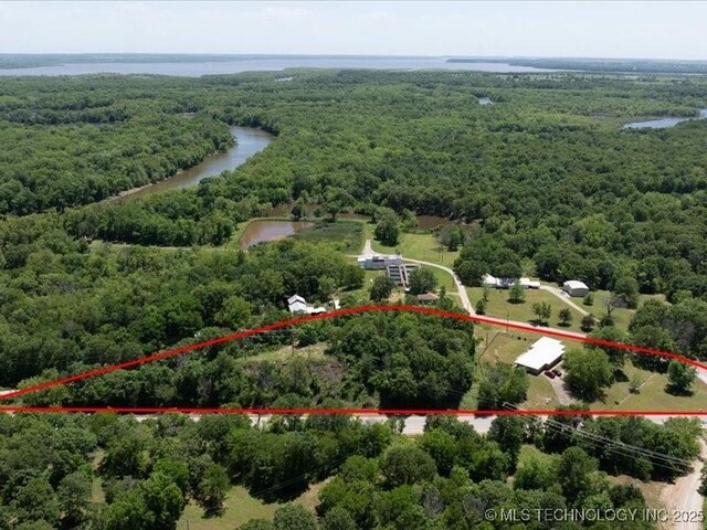 17574 US Highway 60, Nowata, OK 74048 - aerial view of property's location with a forest, a nearby body of water, and property boundaries highlighted