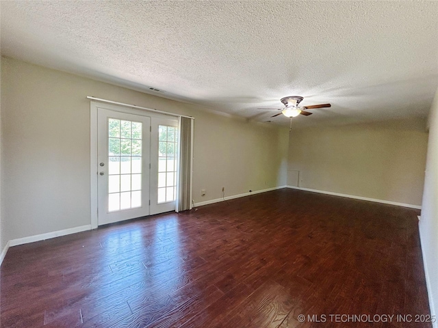502 W Elm St, Henryetta, OK 74437 - unfurnished room with dark wood-type flooring, ceiling fan, and a textured ceiling