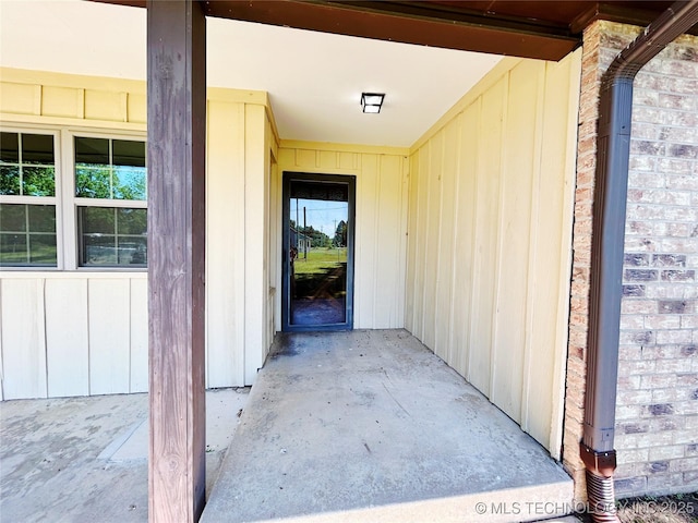 502 W Elm St, Henryetta, OK 74437 - doorway to property with board and batten siding