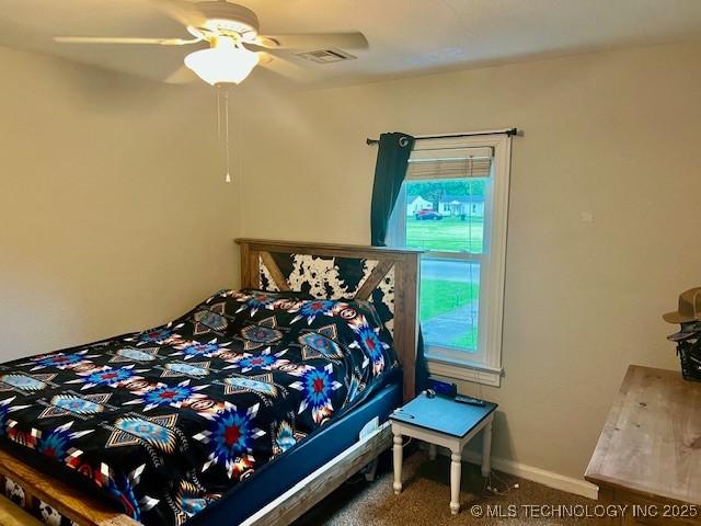 2201 Baugh St, Muskogee, OK 74403 - carpeted bedroom with baseboards and ceiling fan