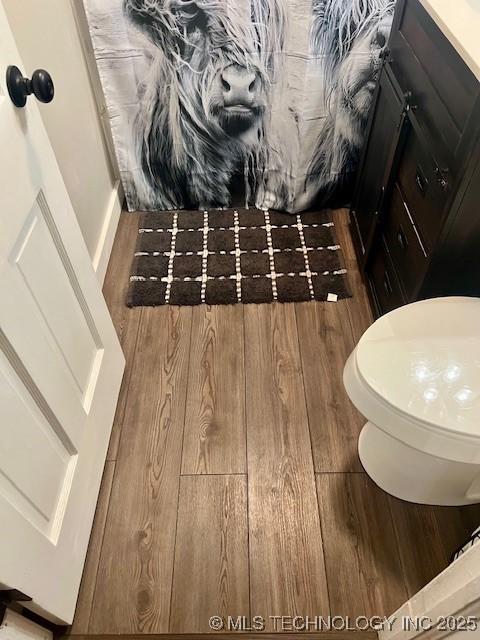2201 Baugh St, Muskogee, OK 74403 - bathroom with wood finished floors and toilet