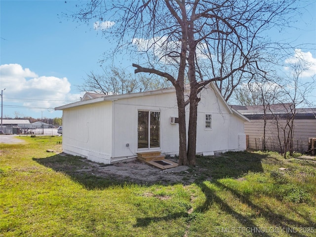 416 S Cedar St, Owasso, OK 74055 - rear view of house with entry steps and a lawn
