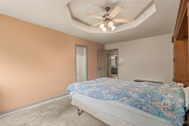 4157 New Prue Rd, Sand Springs, OK 74063 - carpeted bedroom featuring a raised ceiling, a ceiling fan, and baseboards