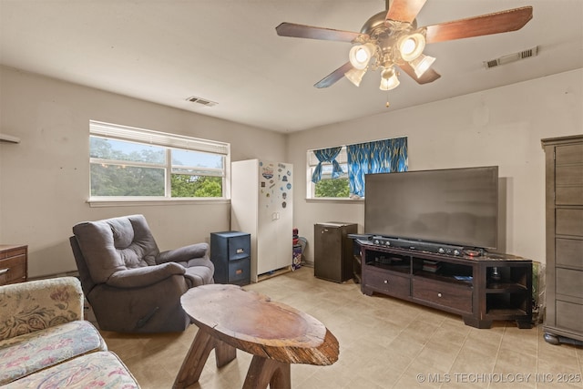 4157 New Prue Rd, Sand Springs, OK 74063 - living room featuring a ceiling fan and light tile patterned floors