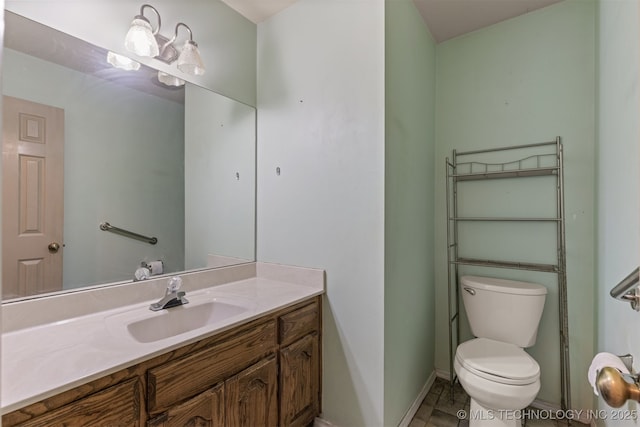 4157 New Prue Rd, Sand Springs, OK 74063 - bathroom with baseboards, toilet, and vanity