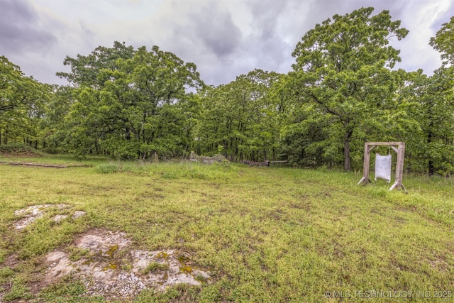 4157 New Prue Rd, Sand Springs, OK 74063 - view of green lawn with a wooded view