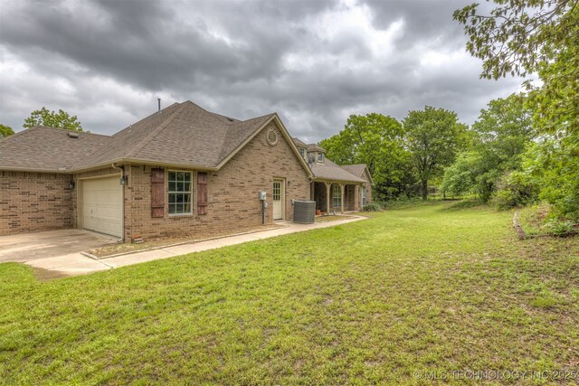 4157 New Prue Rd, Sand Springs, OK 74063 - exterior space featuring an attached garage, concrete driveway, and cooling unit