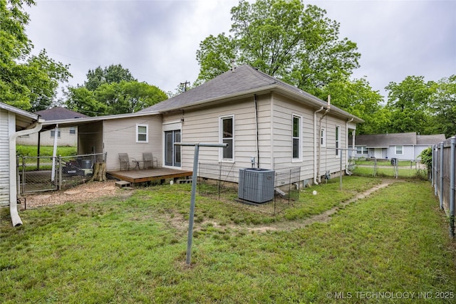1020 N 3rd, Durant, OK 74701 - back of property with central AC, a wooden deck, and a gate