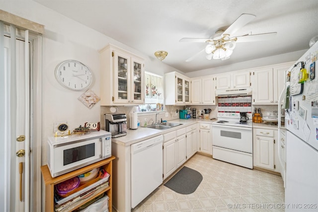 32410 W 301st St S, Bristow, OK 74010 - kitchen with white appliances, a sink, under cabinet range hood, a ceiling fan, and backsplash
