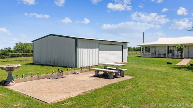 32410 W 301st St S, Bristow, OK 74010 - view of yard featuring an outdoor structure, a garage, and a porch
