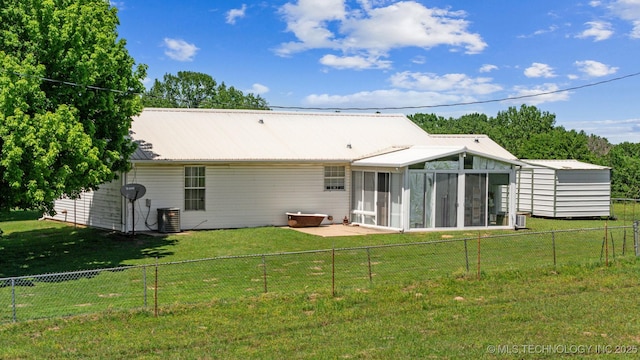 32410 W 301st St S, Bristow, OK 74010 - back of house with a sunroom, metal roof, and a patio