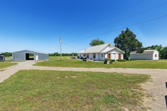 780452 S 3530, Cushing, OK 74023 - view of front of property with an outbuilding, driveway, and a front lawn