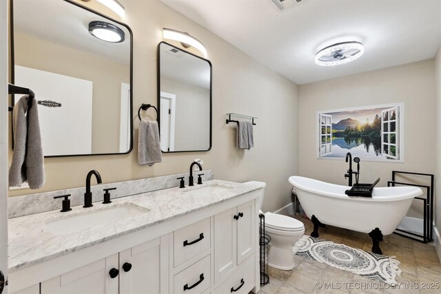 780452 S 3530, Cushing, OK 74023 - bathroom featuring a freestanding tub and double vanity