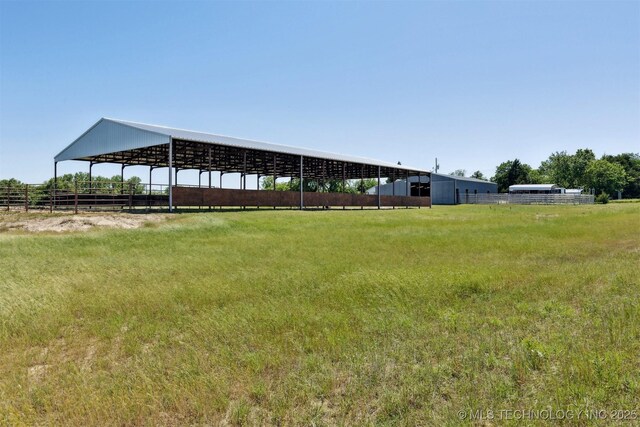 780452 S 3530, Cushing, OK 74023 - view of yard with a covered riding arena and a view of rural / pastoral area
