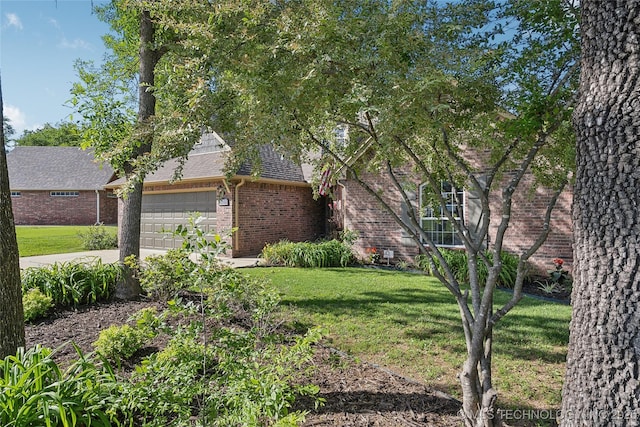 26233 E 114th Pl, Coweta, OK 74429 - view of front of home with brick siding, a front yard, a garage, roof with shingles, and concrete driveway