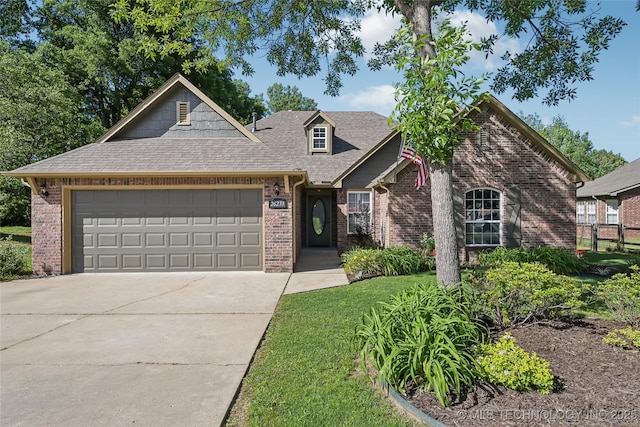 26233 E 114th Pl, Coweta, OK 74429 - view of front of home with brick siding, a garage, driveway, roof with shingles, and a front yard