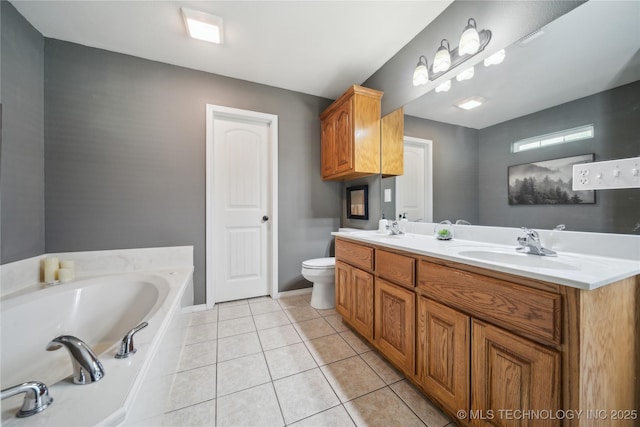 26233 E 114th Pl, Coweta, OK 74429 - full bathroom featuring a garden tub, toilet, tile patterned floors, double vanity, and baseboards