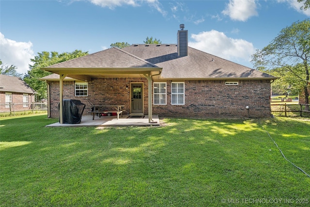 26233 E 114th Pl, Coweta, OK 74429 - back of property with a patio area, a chimney, and brick siding