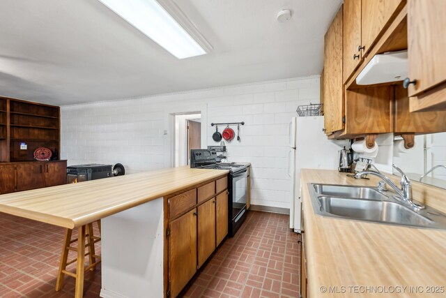 370463 E 5750th Rd, Terlton, OK 74081 - kitchen featuring electric range, brick patterned flooring, a sink, and brown cabinets