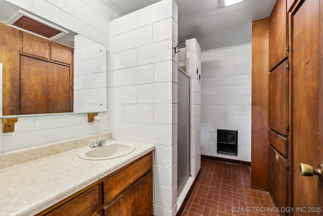 370463 E 5750th Rd, Terlton, OK 74081 - full bathroom with vanity, a stall shower, brick patterned flooring, heating unit, and a fireplace