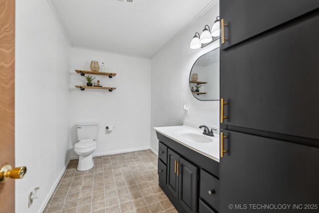 370463 E 5750th Rd, Terlton, OK 74081 - bathroom featuring ornamental molding, vanity, toilet, and baseboards