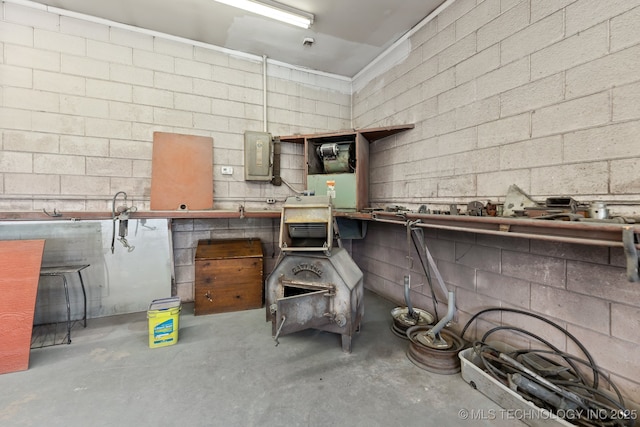 370463 E 5750th Rd, Terlton, OK 74081 - kitchen featuring concrete flooring, electric panel, and concrete block wall