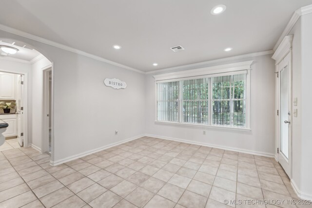 370463 E 5750th Rd, Terlton, OK 74081 - spare room featuring arched walkways, light tile patterned flooring, recessed lighting, ornamental molding, and baseboards