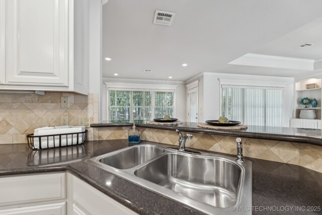 370463 E 5750th Rd, Terlton, OK 74081 - kitchen featuring a sink, white cabinets, decorative backsplash, crown molding, and recessed lighting