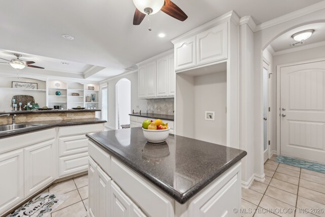 370463 E 5750th Rd, Terlton, OK 74081 - kitchen with arched walkways, ceiling fan, ornamental molding, light tile patterned floors, and recessed lighting