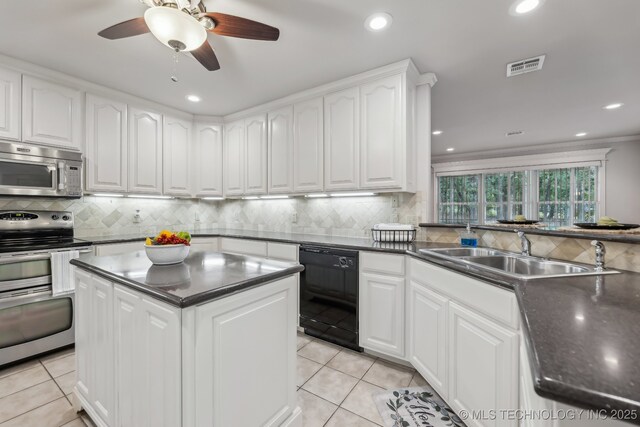 370463 E 5750th Rd, Terlton, OK 74081 - kitchen featuring stainless steel appliances, a sink, light tile patterned flooring, backsplash, and recessed lighting