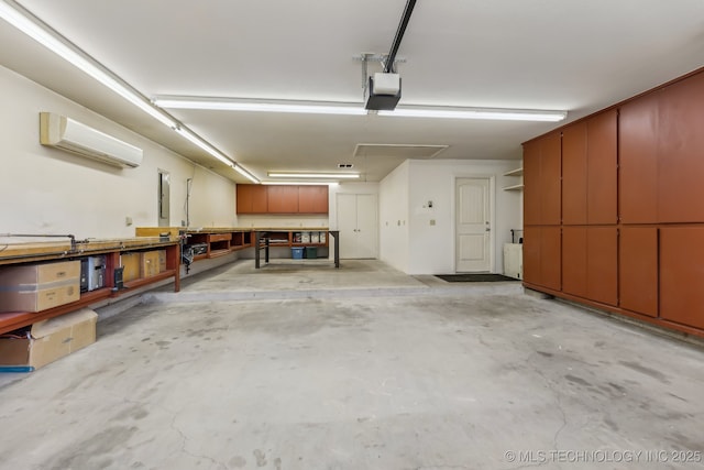 370463 E 5750th Rd, Terlton, OK 74081 - garage with an AC wall unit, a garage door opener, and a workshop area