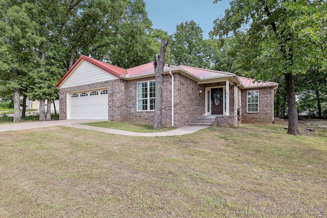 370463 E 5750th Rd, Terlton, OK 74081 - ranch-style house featuring a garage, brick siding, a front lawn, driveway, and metal roof