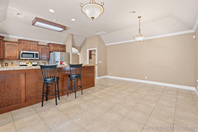 28744 N 3964th Rd, Ochelata, OK 74051 - kitchen featuring appliances with stainless steel finishes, lofted ceiling, backsplash, ornamental molding, and pendant lighting