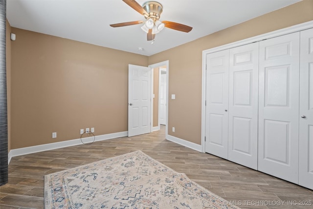 28744 N 3964th Rd, Ochelata, OK 74051 - unfurnished bedroom featuring baseboards, wood finished floors, a closet, and ceiling fan