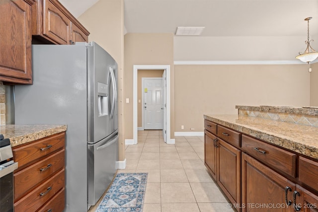 28744 N 3964th Rd, Ochelata, OK 74051 - kitchen featuring stainless steel fridge with ice dispenser, light tile patterned floors, hanging light fixtures, baseboards, and tile countertops