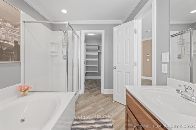 28744 N 3964th Rd, Ochelata, OK 74051 - bathroom featuring a stall shower, vanity, a garden tub, a walk in closet, and ornamental molding