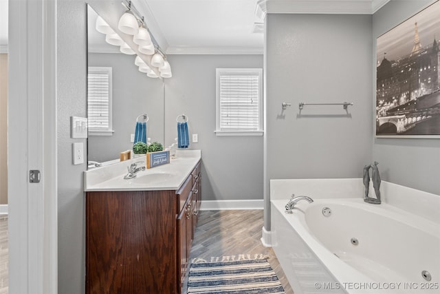 28744 N 3964th Rd, Ochelata, OK 74051 - bathroom featuring a tub with jets, ornamental molding, vanity, wood finished floors, and baseboards