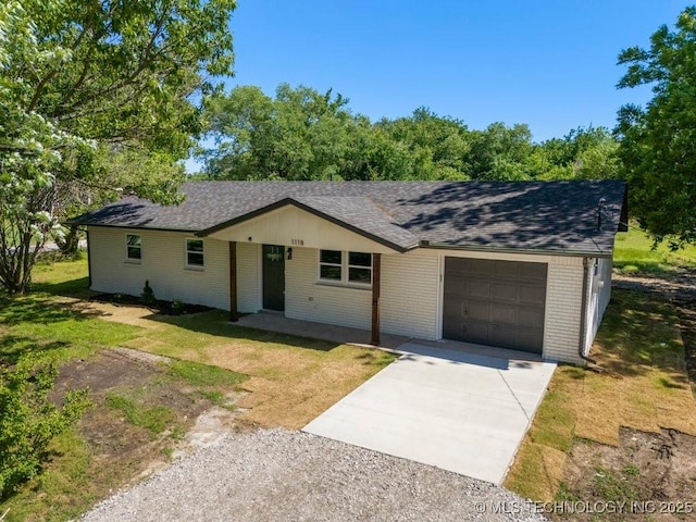1118 E 131st St S, Jenks, OK 74037 - ranch-style house with an attached garage, driveway, brick siding, a front yard, and roof with shingles